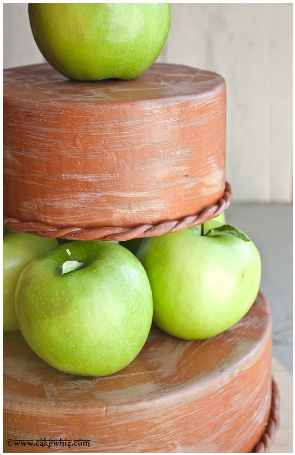 Closeup Shot of Green Apple Dividers Between Two Cake Tiers 