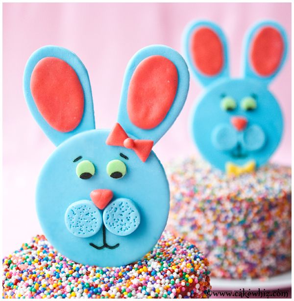 Closeup Shot of Blue Fondant Bunny Topper With Pink Background