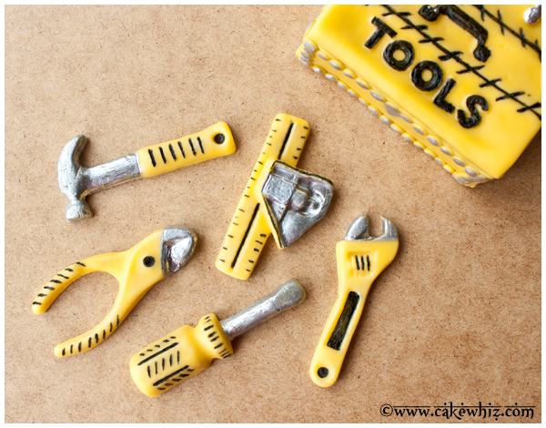 Closeup Shot of Gum Paste Tools on Brown Wood Background